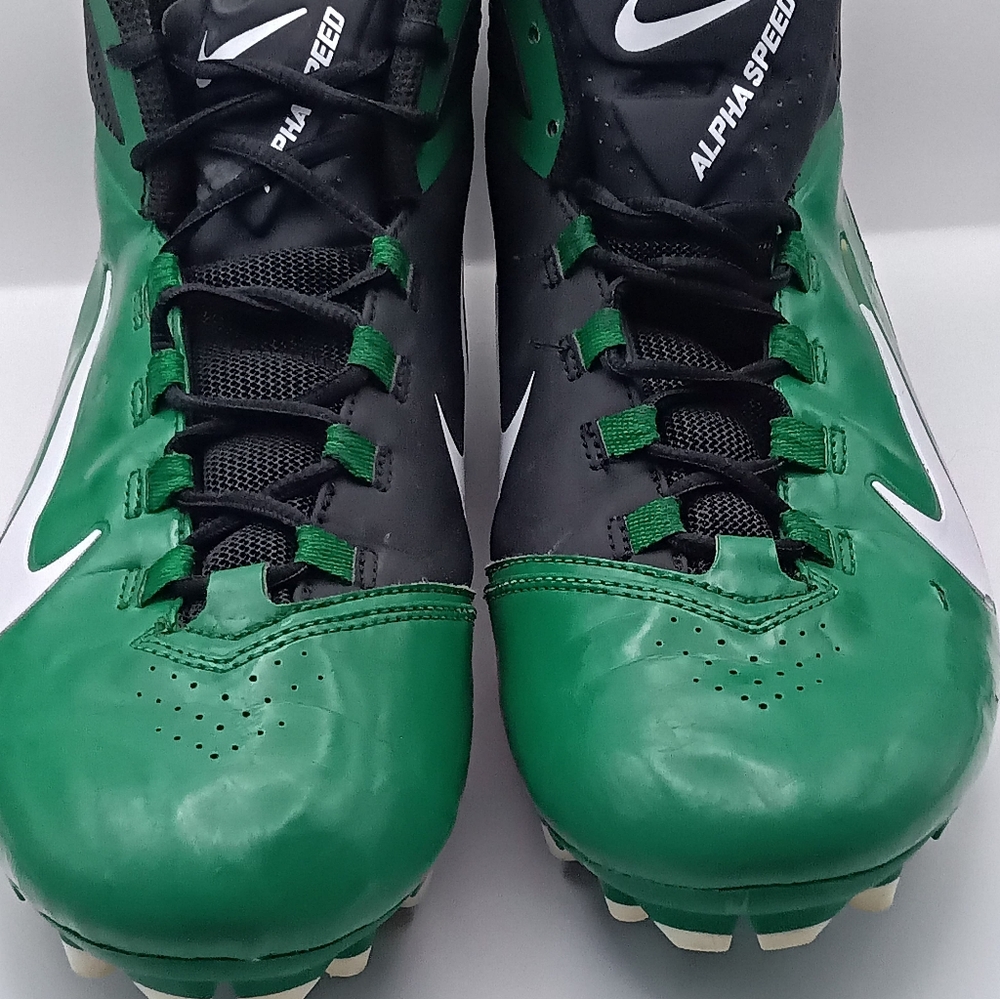 Nike Black and Green Athletic Cleats.